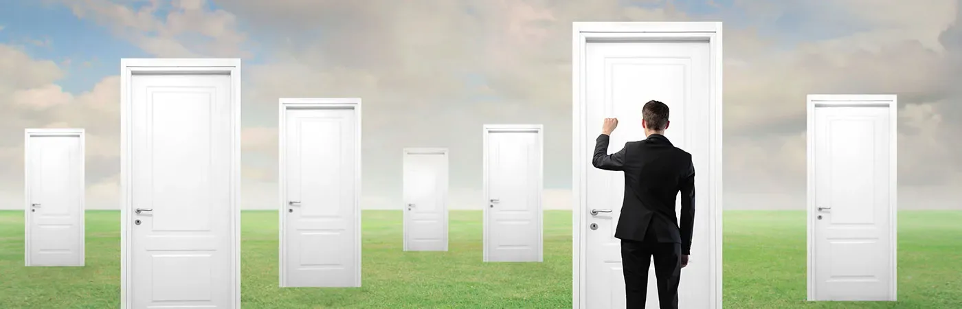 A businessperson knocking on a door