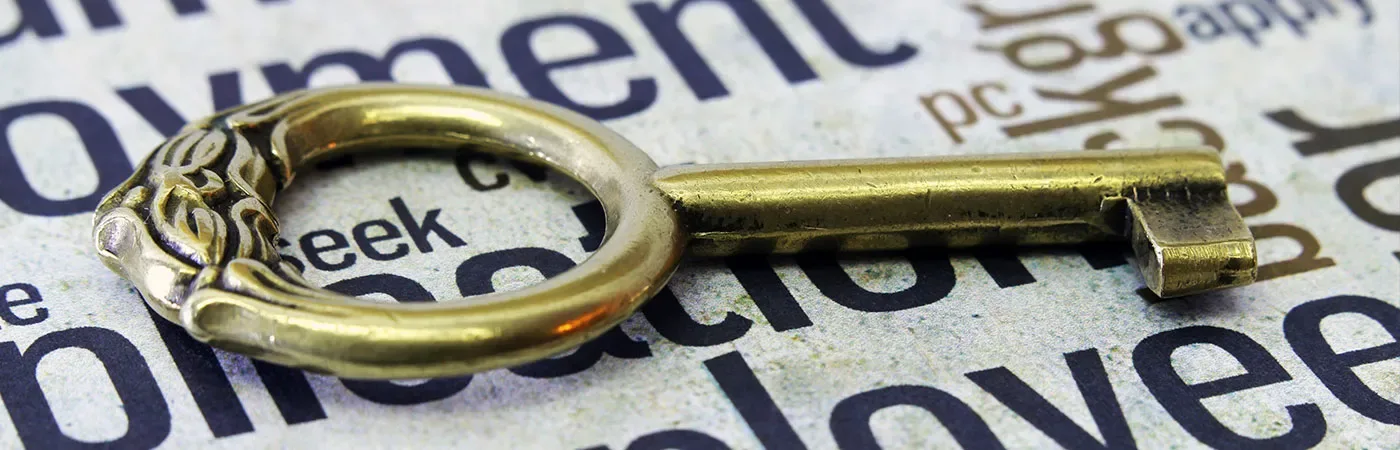 A key atop a cloud of employment related terminology